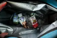 Drinks and ice inside the Igloo Latitude Snapdown 36-Can Cooler Bag
