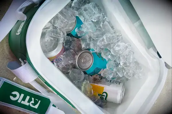 Ice and canned beverages inside the RTIC Insulated Soft Cooler Bag