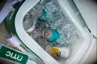 Ice and canned beverages inside the RTIC Insulated Soft Cooler Bag