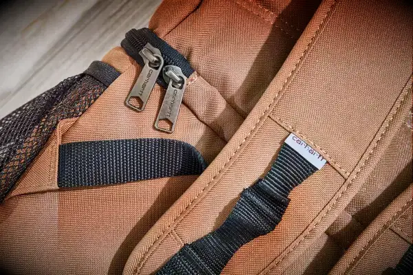Close-up of zippers and straps on the Carhartt 2-in-1 Insulated Cooler Backpack