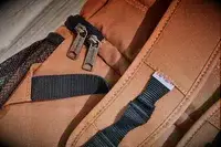Close-up of zippers and straps on the Carhartt 2-in-1 Insulated Cooler Backpack