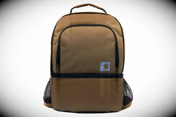 A woman walking outdoors while carrying the Hydro Flask 26 L Day Escape Soft Cooler Tote