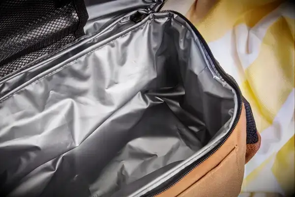 Drinks and snacks on ice inside the Hydro Flask 26 L Day Escape Soft Cooler Tote