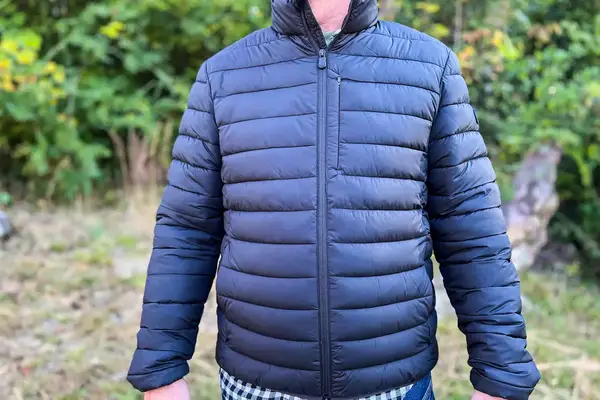 A person wears the Save The Duck Erion Packable Quilted Puff Jacket
