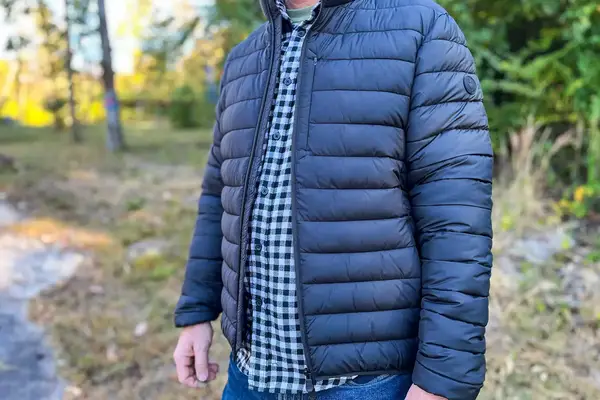 A person wears the Save The Duck Erion Packable Quilted Puff Jacket outside