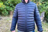 A person wears the Save The Duck Erion Packable Quilted Puff Jacket