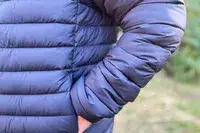 A person with their hand in the pocket of the Save The Duck Erion Packable Quilted Puff Jacket