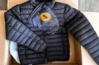 The Save The Duck Erion Packable Quilted Puff Jacket with its storage bag
