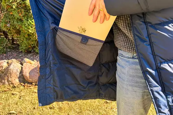 A person places a laptop into the Helly Hansen Men