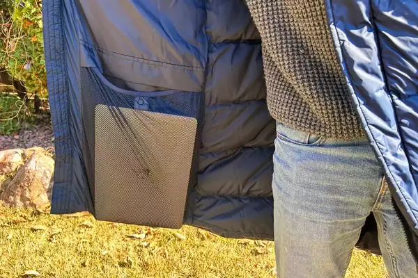 A person shows a laptop in the Helly Hansen Men