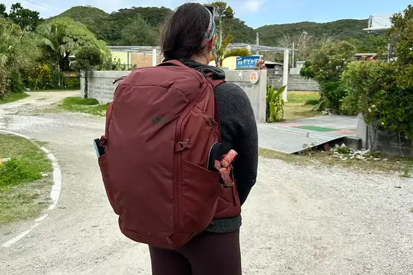 person carrying hiking backpack