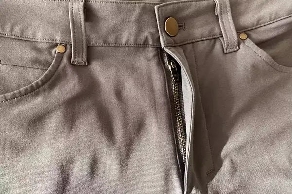 Closeup of the front fly of lululemon ABC Classic-fit Pant Warpstreme