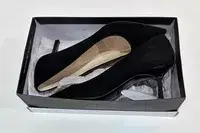 Nine West Kuna 9x9 Pointy Toe Pumps inside of the shoe box with the wrapping
