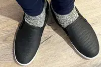 Feet wearing Dr. Scholl