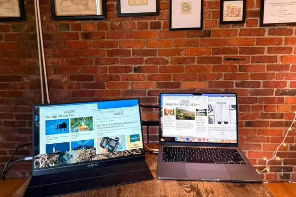 Opened ARZOPA Portable Monitor next to an opened macbook pro.