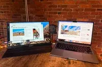 Opened ARZOPA Portable Monitor next to an opened macbook pro.