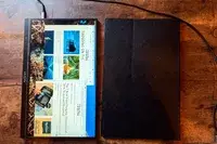 Above view of Portable Monitor next to a case.