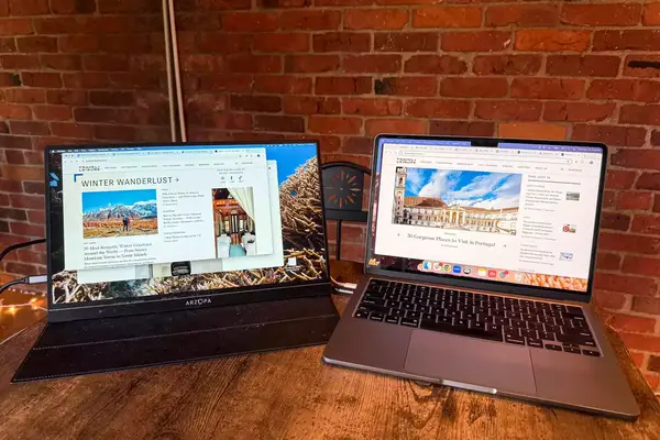 Opened ARZOPA Portable Monitor next to an opened macbook pro.