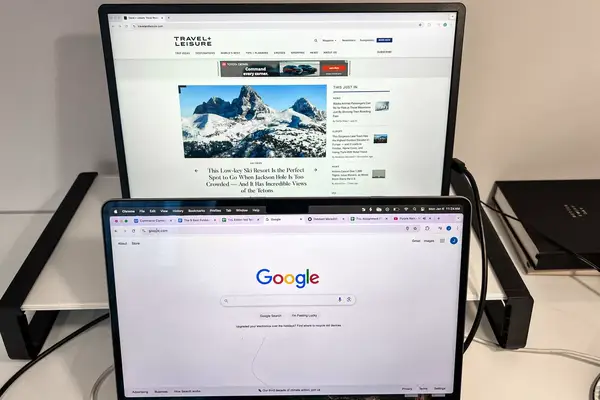 MSI Pro MP161 E2 Portable Monitor on a shelf above the macbook pro.