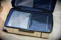 An opened Travelpro x Travel & Lanetrek Large Check-In Trunk Spinner