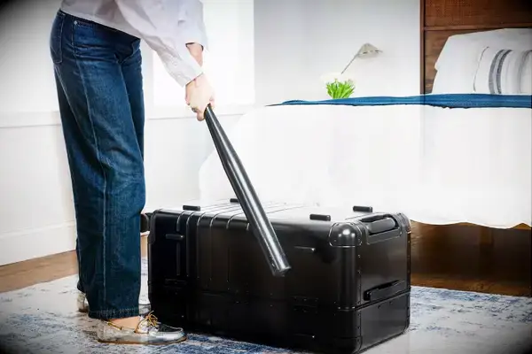 A person hits the Monos Aluminum Trunk with a baseball bat
