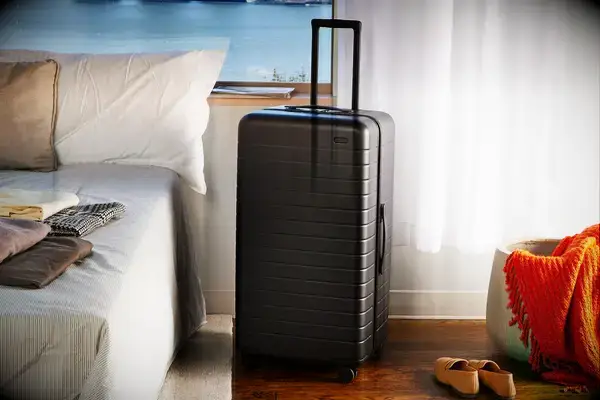 Away The Trunk displayed next to a bed