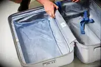 An opened, empty Delsey Paris Cruise 3.0 26 Inch Trunk