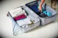 A packed Delsey Paris Cruise 3.0 26 Inch Trunk