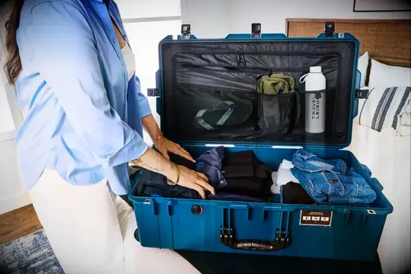A person packs the Pelican 1615TRVL Air Travel Case