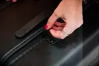 Hand zipping the Away The Trunk