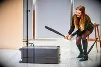 Person hitting the Away The Trunk with a baseball bat