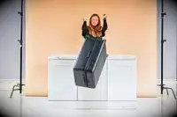 Person pushing the Away The Trunk off a counter