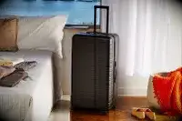 Away The Trunk displayed next to a bed