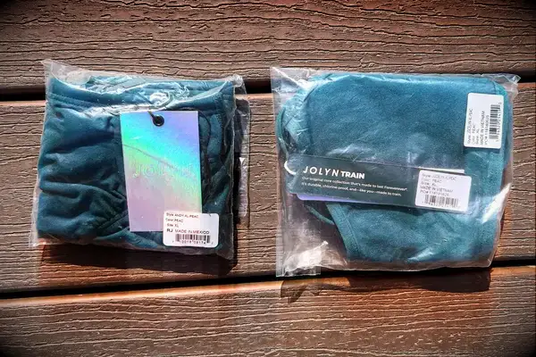 Two packaged clothing items labeled 