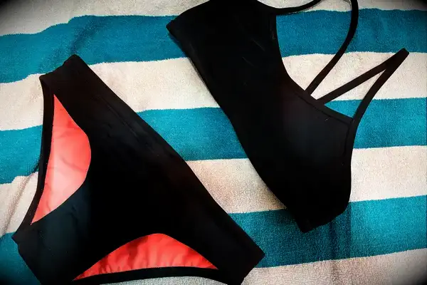 The Jolyn Jocelyn Bikini Top and Jolyn Andy Bikini Bottom on a towel