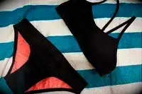 The Jolyn Jocelyn Bikini Top and Jolyn Andy Bikini Bottom on a towel