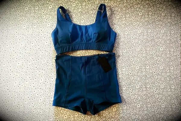 The Sheila Nellie Scoop Bikini Top and Sheila Grace Mini Swim Short on a rug