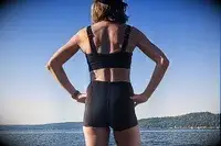 The back of a person wearing the Sheila Nellie Scoop Bikini Top and Sheila Grace Mini Swim Short