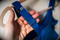 A person touches the adjustable strap on the Sheila Nellie Scoop Bikini Top