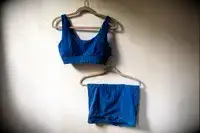 The Sheila Nellie Scoop Bikini Top and Sheila Grace Mini Swim Short hang on a hanger