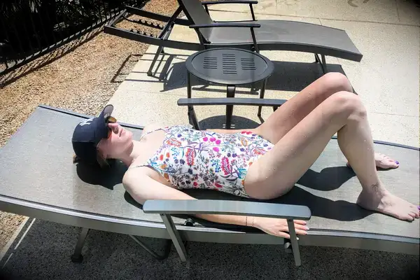 A side view of a person wearing the Andie The Amalfi swimsuit