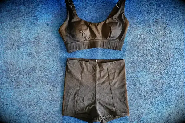 The Sheila Nellie Scoop Bikini Top and Sheila Grace Mini Swim Short on a towel