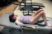 A side view of a person wearing the Andie The Amalfi swimsuit