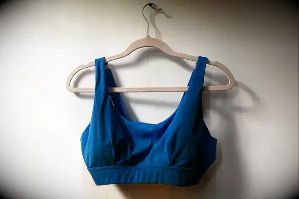 The Sheila Nellie Scoop Bikini Top hangs from a hanger