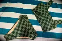 The Albion Olivia Swim Crop Swimsuit Top and Albion Almost Cheeky Swimwear Bottoms on a towel