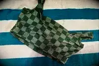 The printed tag on the inside of the Albion Olivia Swim Crop Swimsuit Top