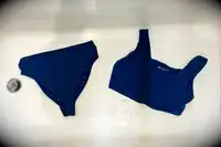 The Albion Olivia Swim Crop Swimsuit Top and Albion Almost Cheeky Swimwear Bottoms in a bathtub