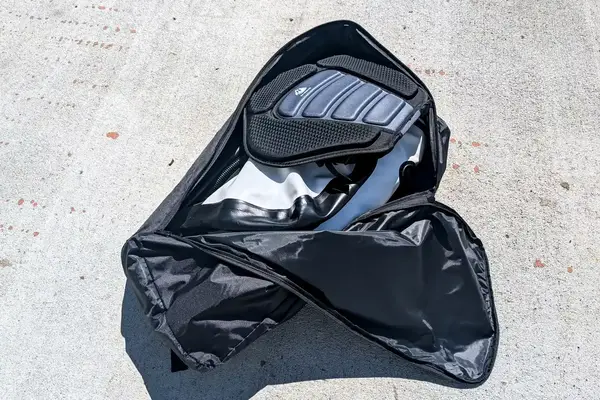 A person and their dog using the SereneLife Inflatable Stand-up Paddleboard on a lake 