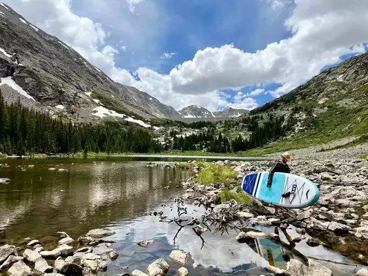 A person inflating the ROC 10’ Explorer