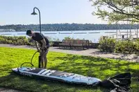 A person inflating the ROC 10’ Explorer